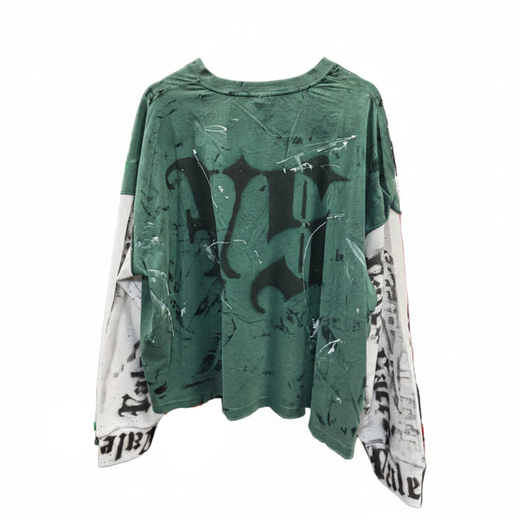 Green graphic t-shirt with black designs